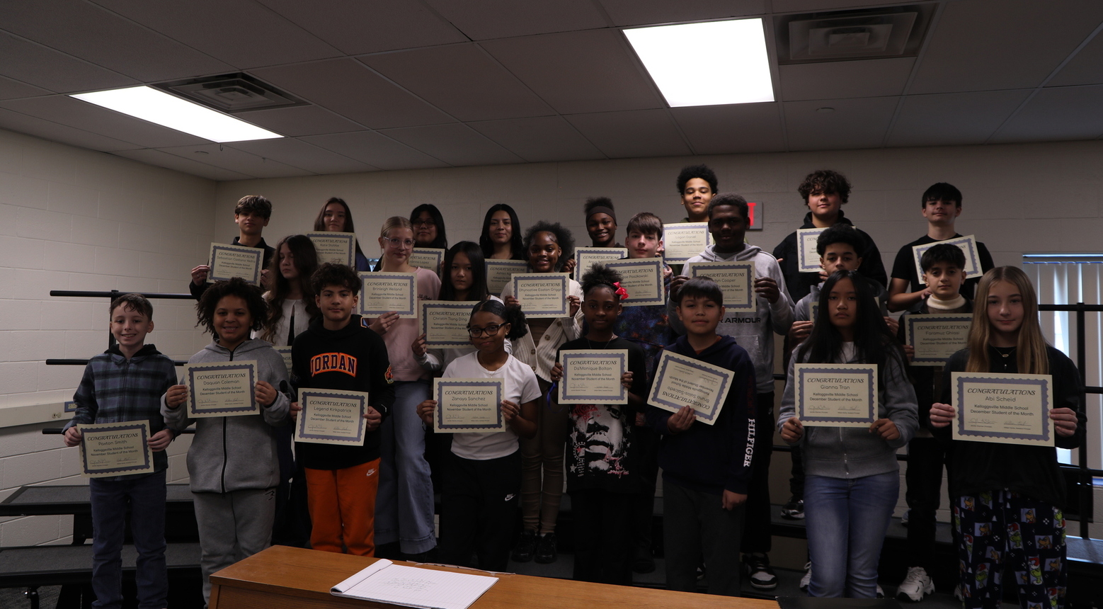 Students receiving Student of the Month award at KMS.