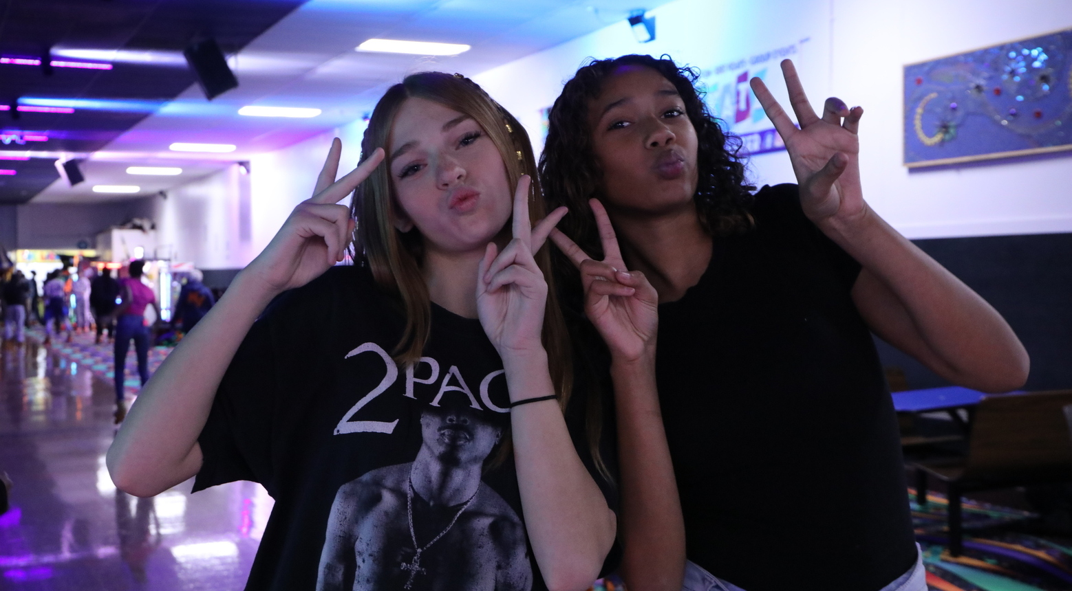 Students posing for photo at rewards skating party.